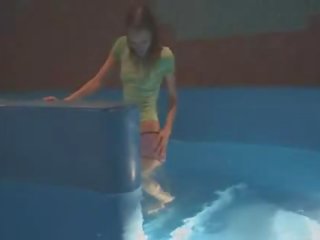 Thin young female mastrubating in pool